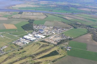 General oblique aerial view of Muir of Ord, looking SE.