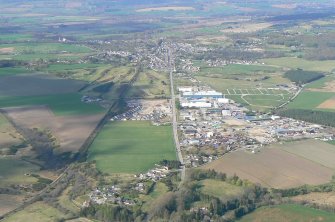 General oblique aerial view of Muir of Ord, looking N.