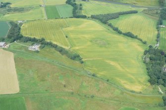 Aerial view of Tarradale Barrow cemetery and surrounding fields under crop, Beauly Firth, looking NNW.