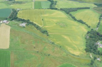 Aerial view of Tarradale Barrow cemetery and surrounding fields under crop, Beauly Firth, looking NW.