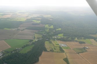 Aerial view of Cawdor Village and Cawdor Wood, E of Inverness, looking SSE.