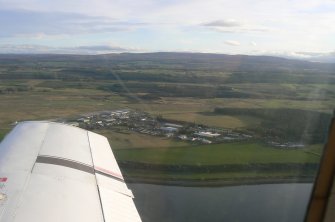 An oblique aerial view of Inverness Airport, Dalcross, Inverness, looking SSE.