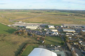 An oblique aerial view of Inverness Airport, Dalcross, Inverness, looking SE.