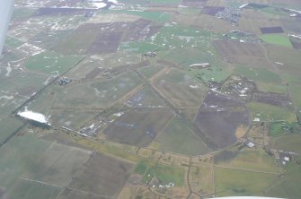 An oblique aerial view of the former military airfield in the parish of Fearn on the Tarbat Peninsula, looking NNE.