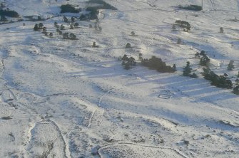 Aerial view of Strath Sgitheach enclosures, rigs, hut circles and possible barrow, near Dingwall, Easter Ross, looking SE.