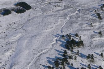 Aerial view of Strath Sgitheach hut circle settlement, square enclosure and sheepfold, near Dingwall, Easter Ross, looking E.