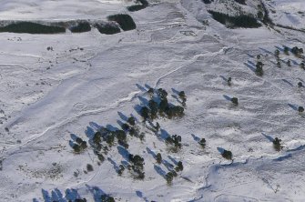 Aerial view of Strath Sgitheach hut circle settlement, square enclosure and sheepfold, near Dingwall, Easter Ross, looking E.