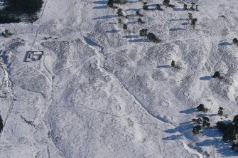 Aerial view of Strath Sgitheach hut circle settlement and later sheepfold, near Dingwall, Easter Ross, looking ESE.