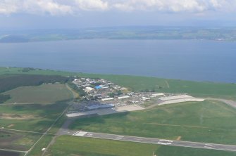 Aerial view of Inverness Airport and Dalcross Industrial Estate, E of Inverness, looking NW.