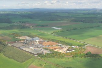 Near aerial view of the Norbord Factory, Morayhill, E of Inverness.