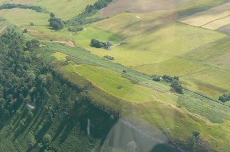 Close aerial view of Knock Farrel hill fort, near Strathpeffer, Easter Ross, looking SE.