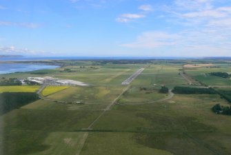 Aerial view of Dalcross airport runway, E of Inverness, looking NE.