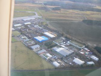 Aerial view of Dalcross Industrial Estate and Inverness Airport, looking SSE.