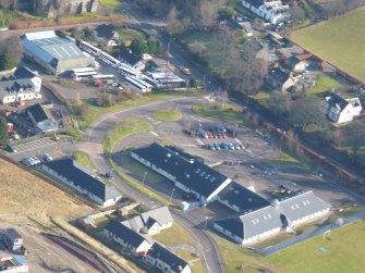 Aerial view of Strathpeffer Community Centre and Bus Depot, Easter Ross, looking SE.
