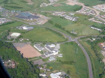 Aerial view of Inverness Royal Academy and the Southern distributor road, looking N.