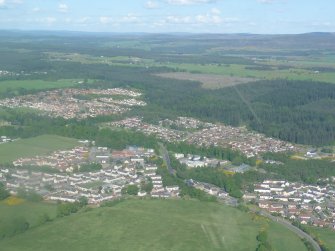 Very distant aerial view of the Culloden area, Inverness, looking S.