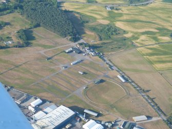 Aerial view of Mannsfield Showground and Gilchrist cropmark fort site, Muir of Ord, Black Isle, looking NE.