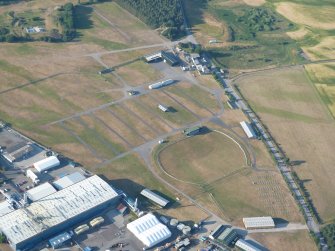 Aerial view of Mannsfield Showground and Gilchrist cropmark fort site, Muir of Ord, Black Isle, looking NNE.