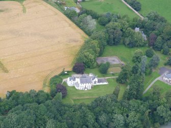 Aerial view of Dunain House, Stables and Walled Garden, S of Inverness, looking N.