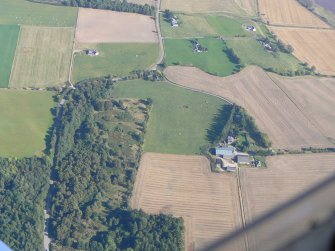 An oblique aerial view of Tarradale Mains, near Muir of Ord, Black Isle, looking E.