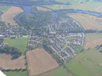 An oblique aerial view of Beauly, near Muir of Ord, Black Isle, looking SE.