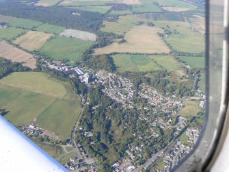 Oblique aerial view of Muir of Ord, Black Isle, looking NW.