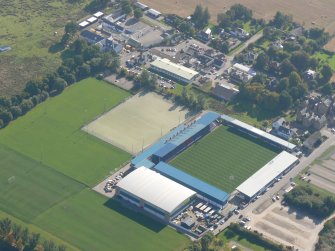 An oblique aerial view of Dingwall Football Ground, Easter Ross, looking S.