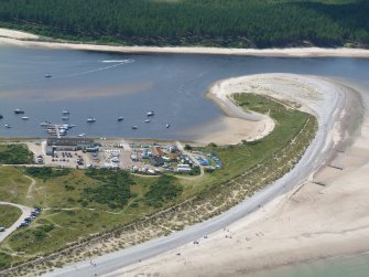 Aerial view of boatyard, yacht club and sea beach at Findhorn, Moray, looking SW.