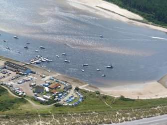 Close-up aerial view of boatyard and yacht club at Findhorn, Moray, looking S.