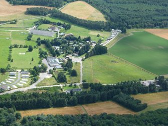 Aerial view of part of site of Forres Airfield at Mundole, Moray, looking SE.