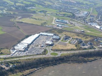 Oblique aerial view of Inverness Retail Park and UHI Beechwood campus, looking S.