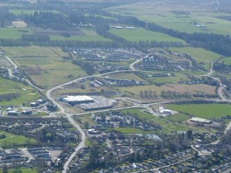 Oblique aerial view of the ASDA Inverness Superstore and Lower Slackbuie area of Inverness, looking SE.
