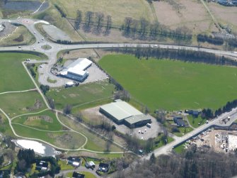 Near vertical aerial view of Rollerbowl bowling centre (in foreground) and Bun-Sgoil Ghaidhlig Inbhir Nis (Inverness Gaelic Primary School), Inverness, looking SE.