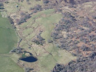 An oblique aerial view of fields N or Breakachy Farm, Kilmorack, looking SW.