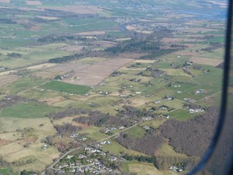An oblique aerial view of the croftlands of Balvaird, near Muir of Ord, looking N.