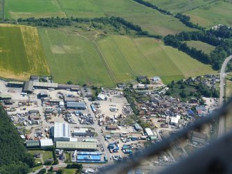 Near aerial view of Baxters, Tomich and Windhill Industrial Estates, Muir of Ord, Black Isle, looking SE.