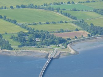 Oblique aerial view of north end of Cromarty Bridge and farmland at Ardullie, Black Isle, looking NW.