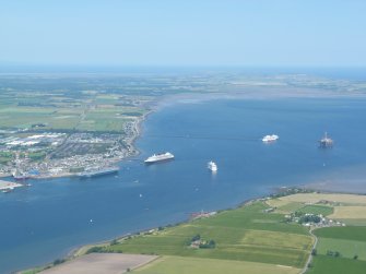 Oblique aerial view from the Black Isle across the Cromarty Firth to Invergordon & Nigg Bay, looking NE.