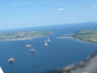 Oblique aerial view of the North and South Sutors at the mouth of the Cromarty Firth, looking E.