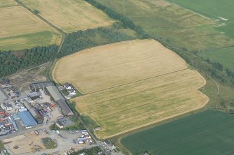 Oblique aerial view of part of the southern section of the industrial estate at Muir of Ord, Black Isle, looking E.