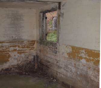 The SW corner on the ground floor with one of the two windows lighting the compartment in the NW wall