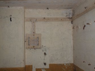 Backboards for electrical fittings and cabling by the NW corner on the ground floor 