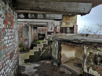 View behind the gun pit (right) of the SW Emplacement from the SW