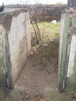 The partly blocked entrance leading into the gun pit of the NE Emplacement