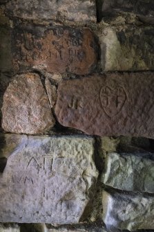 The Monk's cave,
Detail of incised grafitti on left hand side of doorway.