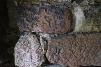 The Monk's cave,
Detail of incised grafitti on left hand side of doorway.