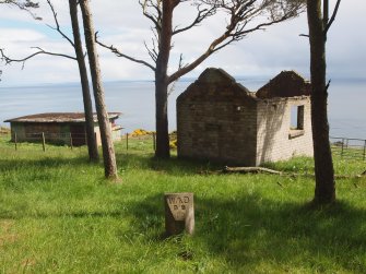 The Boundary Stone (10) from the NW, with the Engine House (NH86NW 9.08) to its right and the Counter Bombardment Post (NH86NW 9.08) to its left