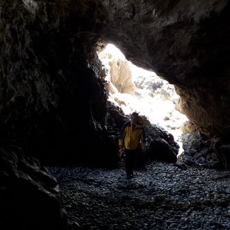 The mouth of the cave SW of the Sentry Light from the interior, which provides an alternative means of access to the Fighting Light of WWI (Adam Welfare in the middle ground) 
