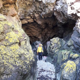 The narrow defile emerging from the NE end of the cave (Adam Welfare in the middle ground) 