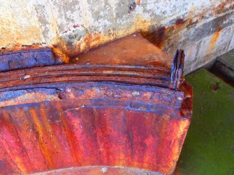The termination of the corroded iron rails for the shuttering at the W end of the parapet wall in the WSW searchlight housing 